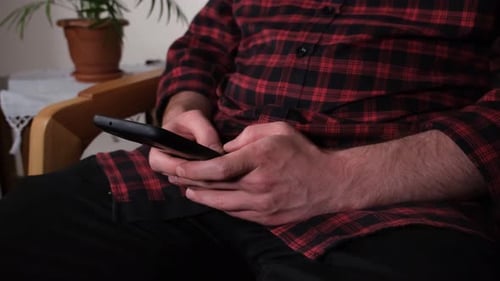 Man Texting on Phone