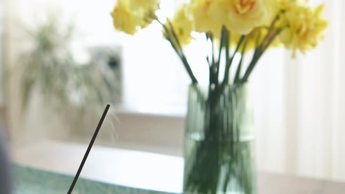 Burning Aromatic Incense Smoky Stick for Meditation and Relaxing with Flowers Background