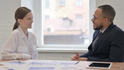 Adults Shaking Hands at Office Meeting