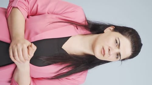 Woman in Pink Blazer Gesturing and Smiling