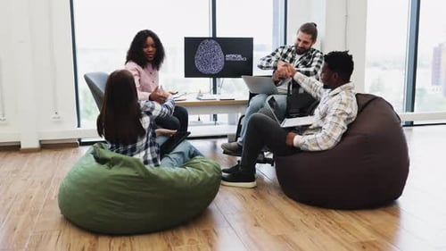 Team Collaborating on Artificial Intelligence Project in a Modern Office Setting