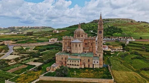Aerial view of historic architecture in Malta surrounded by greenery