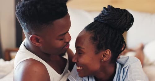 Couple Lying in Bed Hugging