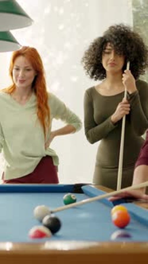 Friends Having Nice Rivalry Playing Pool Together at Home