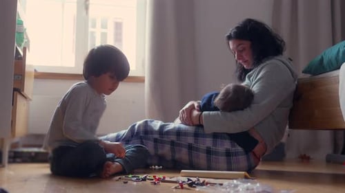 Mother and Children Spending Time Indoors at Home