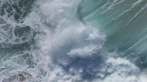 Aerial View of Turquoise Ocean Waves Crashing