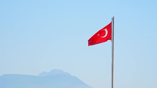 Turkish Flag Waving in the Breeze on Sunny Day