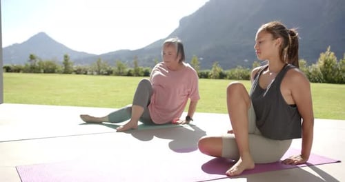 Women Practicing Yoga in an Outdoor Setting