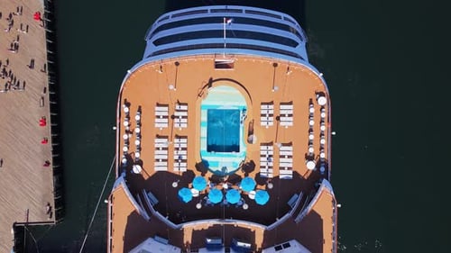 Cruise Ship Passengers Swimming and Sunbathing on Lido Deck Pool and Sun Lounge