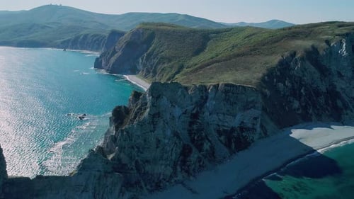 Aerial Panoramic View of Cliffs and Huge Rocks at Seaside and Waves Crashing to the Coast Beautiful