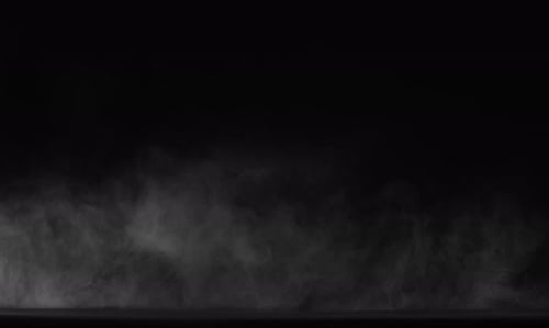 Sahara Collection: Dust floating and lingering over a black background shot at 60fps