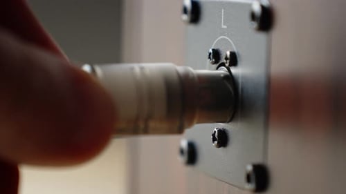 Man Connect Cable to Sound Speaker Plug