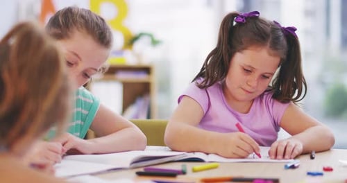 Children Drawing and Coloring in Classroom