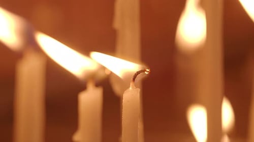 Candles Flickering in a Quiet Chapel During a Serene Evening