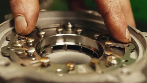 Close-up macro inside moving internal parts of a turbine or automobile turbine turbocharger