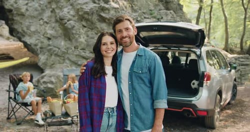 Happy Couple and Family Enjoying Time in Nature
