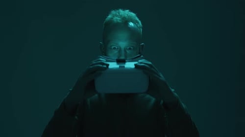 Man Putting on a Virtual Reality Headset