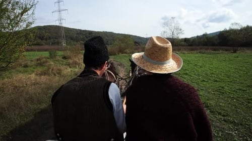 Romanians riding a horse-drawn cart 18