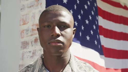 Video of african american soldier standing outside house