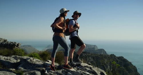 Man, woman and hiking on mountain as adventure climbing, backpack for exercise