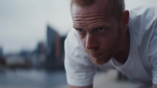 Man Doing Plank Exercise in Urban Setting