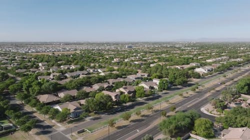 Aerial approaching shot of luxury neighborhood of suburb district in Gilbert Town, Arizona. Wide sho