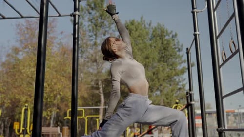 Young Woman Exercising on an Outdoor Fitness Court Sunny Day