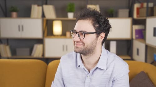 Happy man looking at camera.