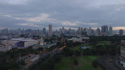 Forwards Fly Above Park in City Aerial Panoramic View of Metropolis Traffic on Roads Around City