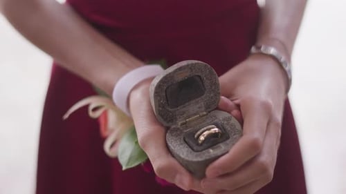 Wedding Rings Held in a Stone Ring Box