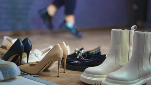 Close up view of shoes on the floor. Slow motion lifestyle stylish footwear.