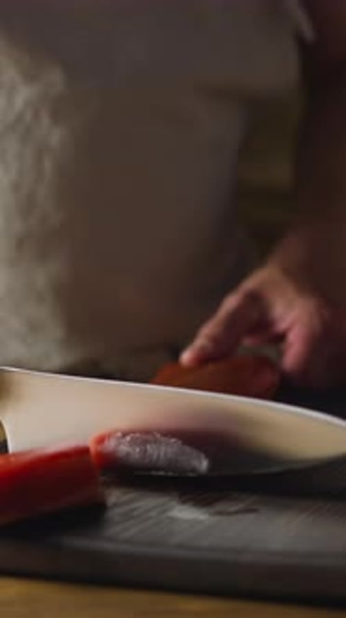 Chef in Apron Chops Delicatessen Cool Smoked Salmon Fillet