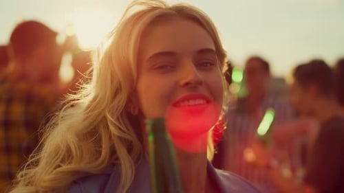 Woman Dancing at a Rooftop Party with Friends