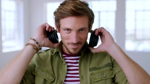 Portrait of geek, man and hipster with headphones for music, podcast and audio playlist