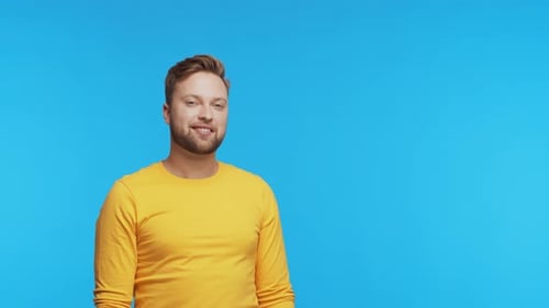 Expressive Young Man Over Vibrant Background Studio Portrait of Handsome Person