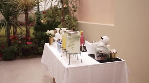 Refreshing Drinks Station at Outdoor Event on Sunny Day