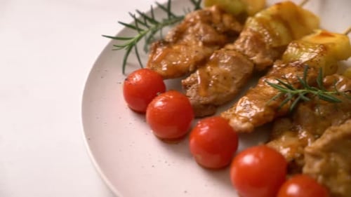 Grilled Pork and Pineapple Skewers on White Plate