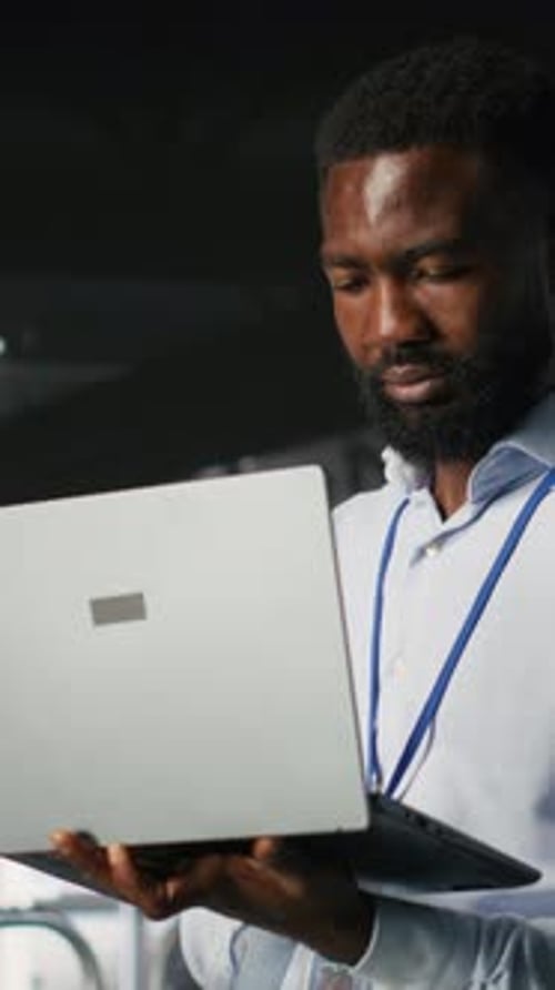 Vertical Video Technicians on Data Center Industrial Platform Analyzing Performance Outputs