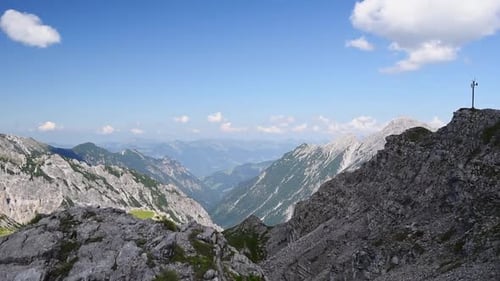 Panoramic view of a mountain top in the alps at Liechtenstein near Schesaplana. Pan left showing whi