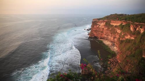 Uluwatu Coastline with Beautiful Rocky Cliffs and Wavy Sea