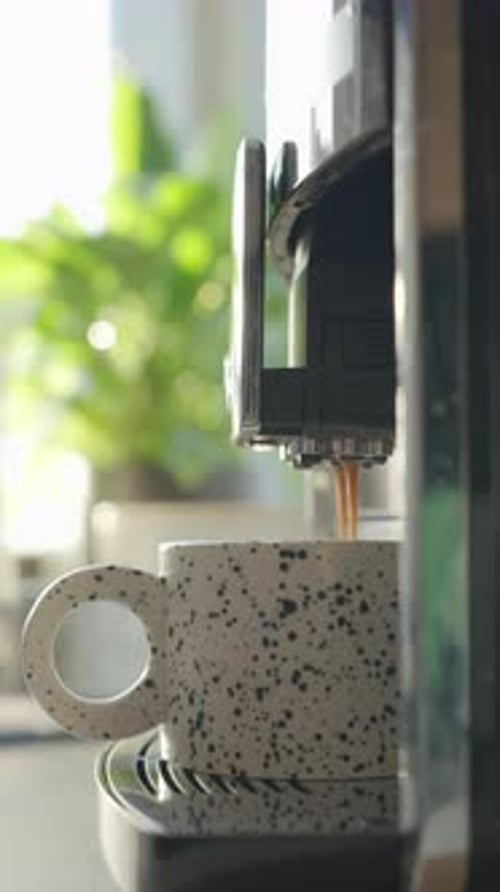 Espresso Machine Filling Dotted Mug Indoors