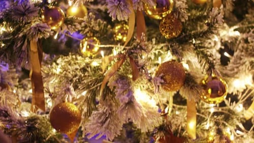 Festive Christmas Tree with Golden Ornaments and Gifts