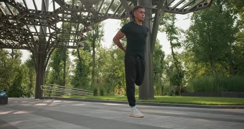Athletic African American Man in Sportswear Stretching Body and Warm Up Before Cardio Workout