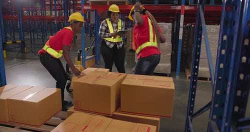 Warehouse team loading delivery boxes - Logistic and industry concept at the warehouse
