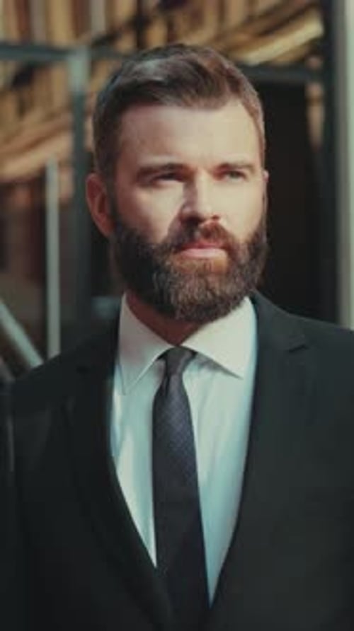 Handsome Man Smiling in a Black Suit