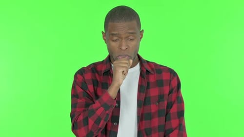 Coughing Sick African Man on Green Background
