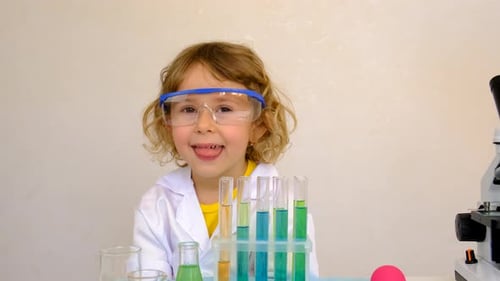 Child in Lab Coat with Science Equipment