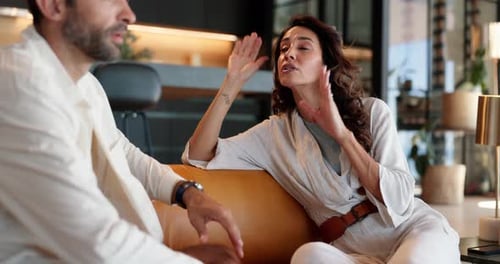 Heated Discussion Between a Woman and a Man Indoors