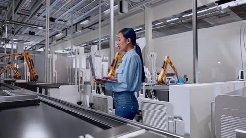 Asia Female Professional Work On Laptop And Look Around, Battery Factory