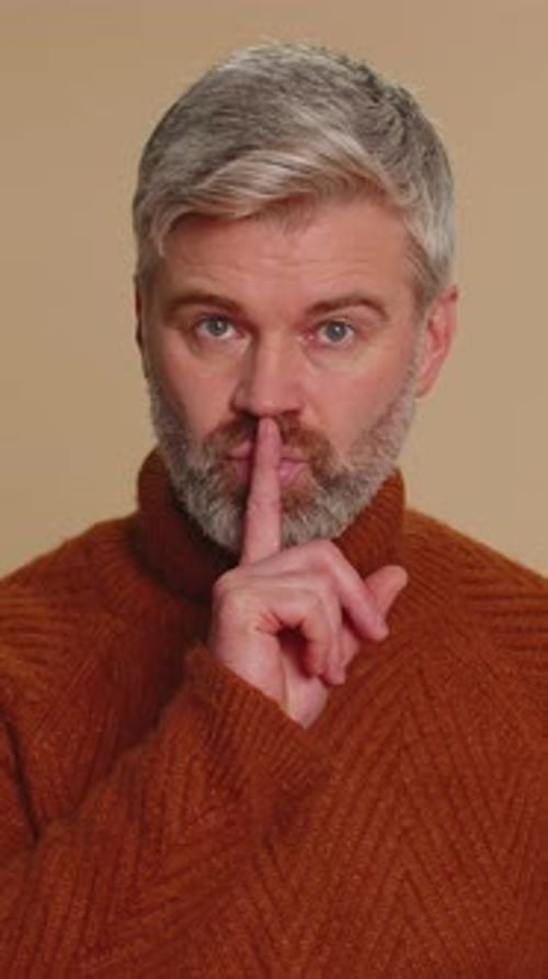 Senior Man Presses Index Finger to Lips Makes Silence Gesture Sign Do Not Tells Secret Shh Be Quiet
